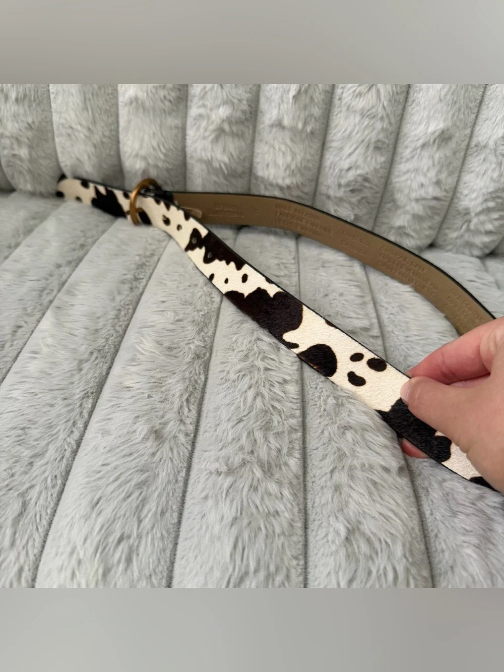 Urban Outfitters leather cow print calf hair belt.